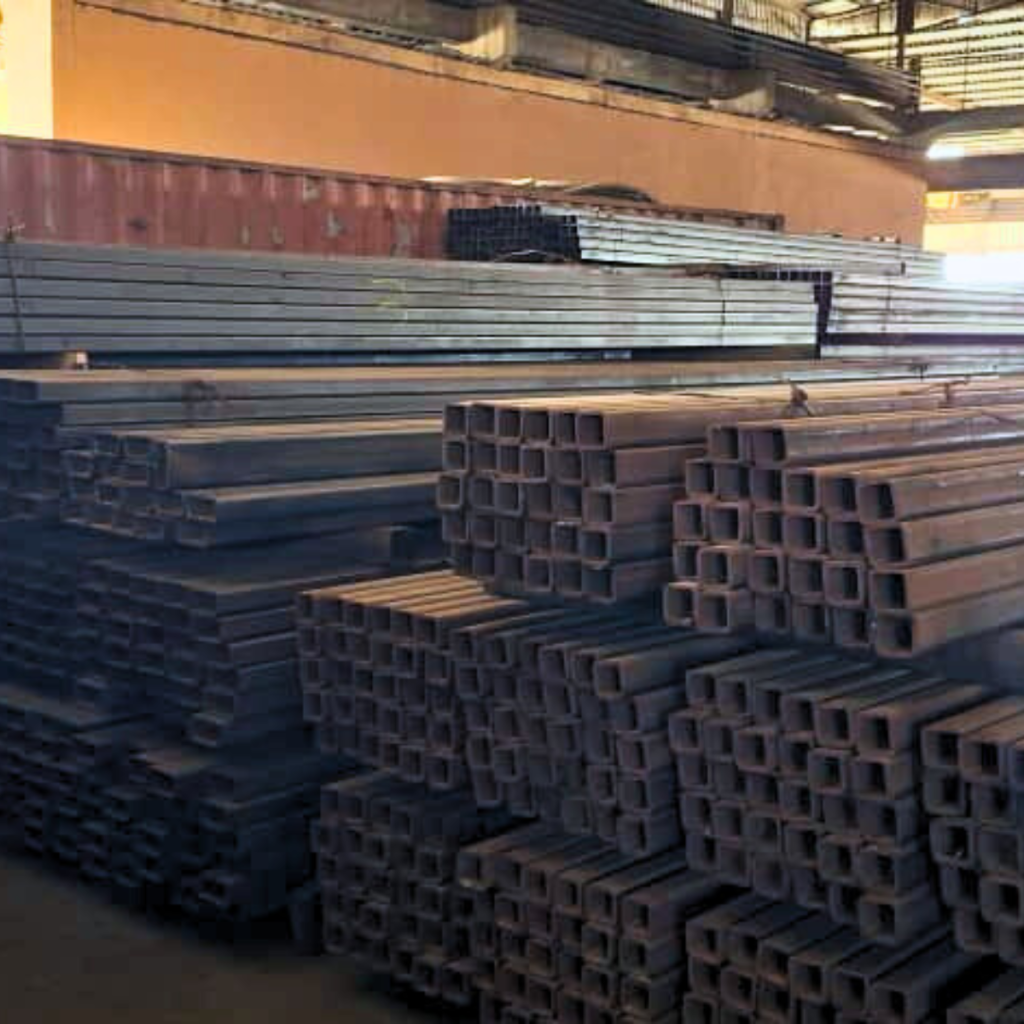 Industrial steel pipes and tubes stacked neatly