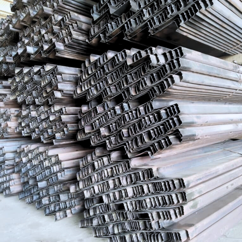Stacked steel beams ready for construction use