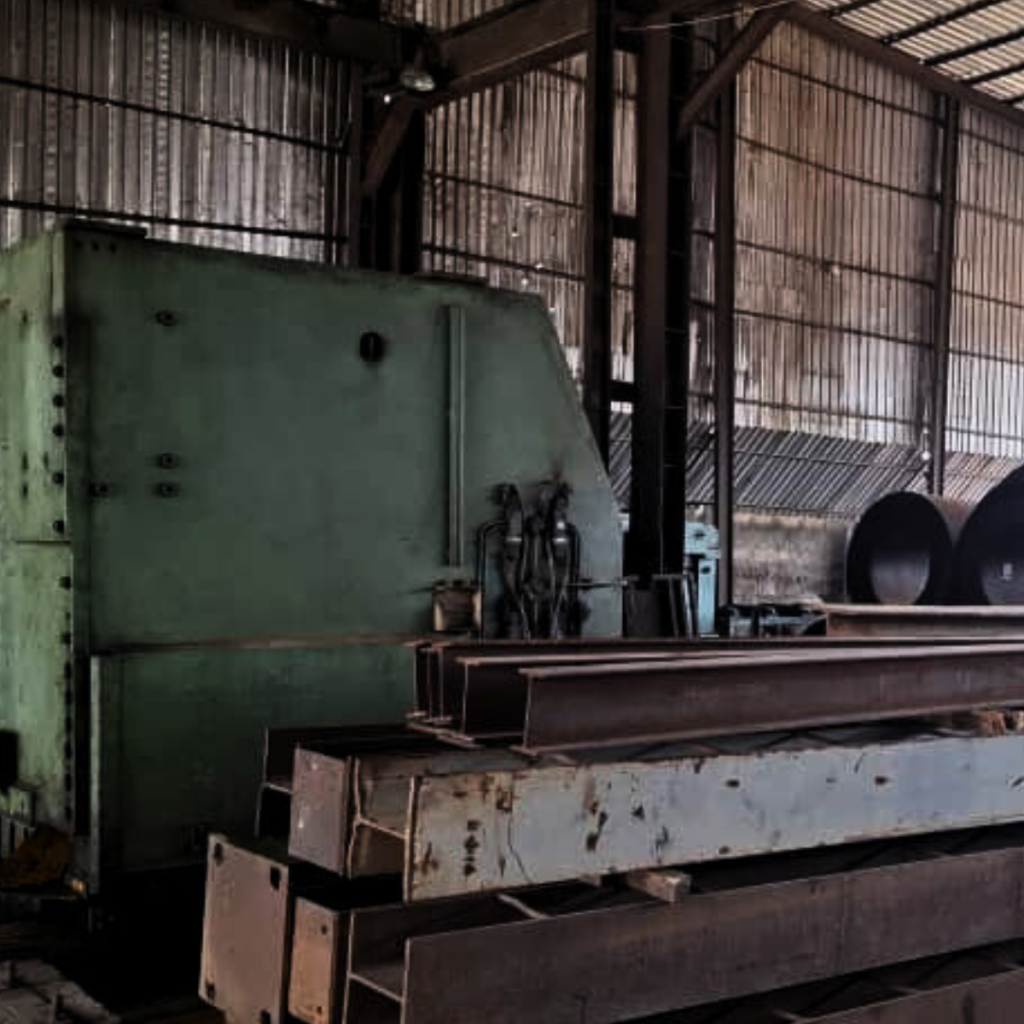 Industrial machinery and metal beams in workshop