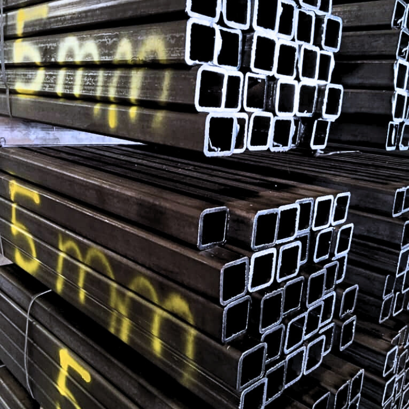Stacked 5mm square steel pipes in warehouse